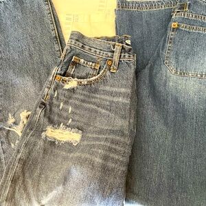 Two pairs of blue jeans for young girls